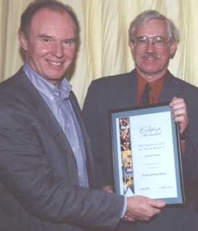 Tim Piggot Smith presents Roger Cornwell with his sponsor's certificate